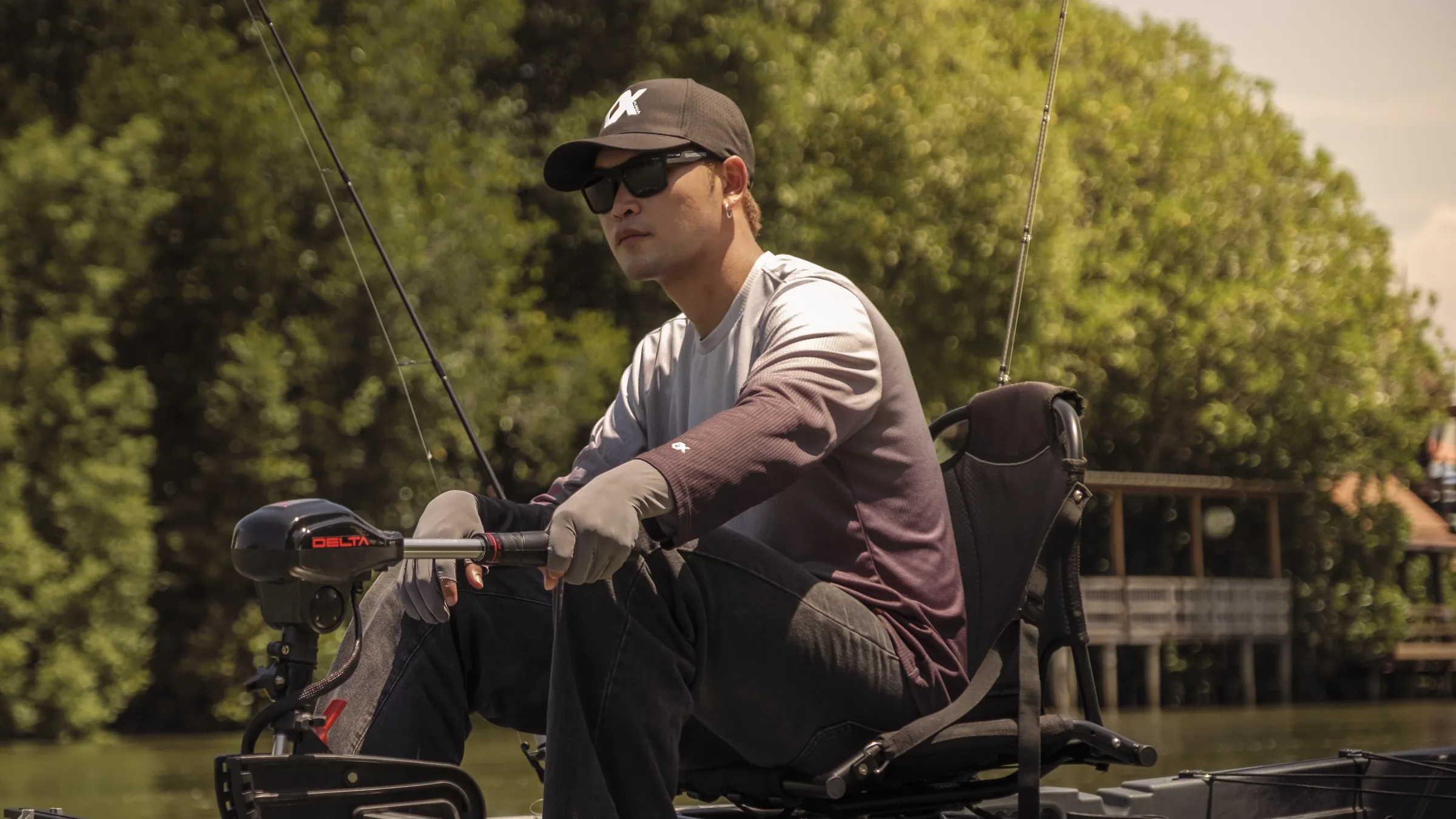 Angler seated on an ALPHA boat with a DELTA trolling motor